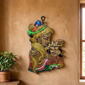 Terracotta wall hanging depicting the Hindu deities Radha and Krishna with a deer.
