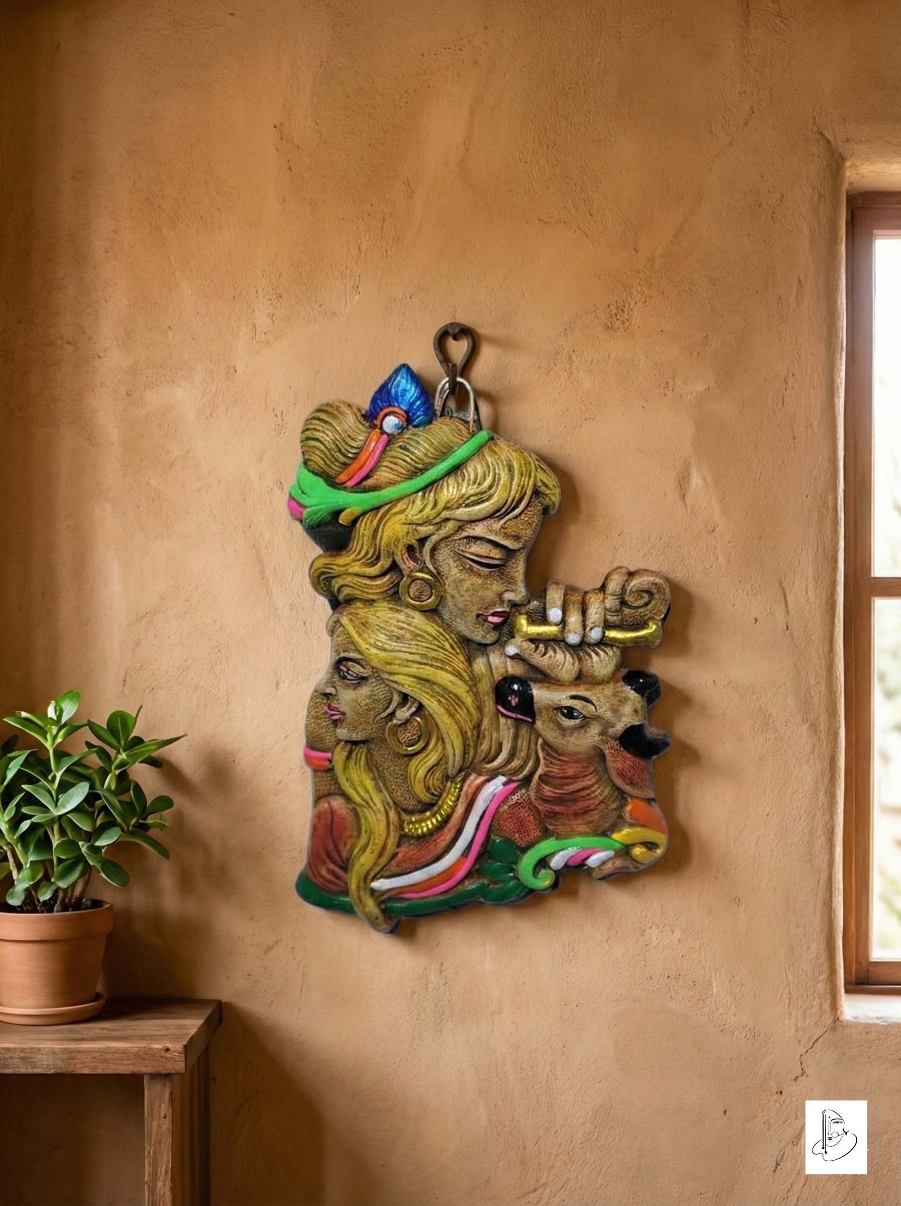 Terracotta wall hanging depicting the Hindu deities Radha and Krishna with a deer.