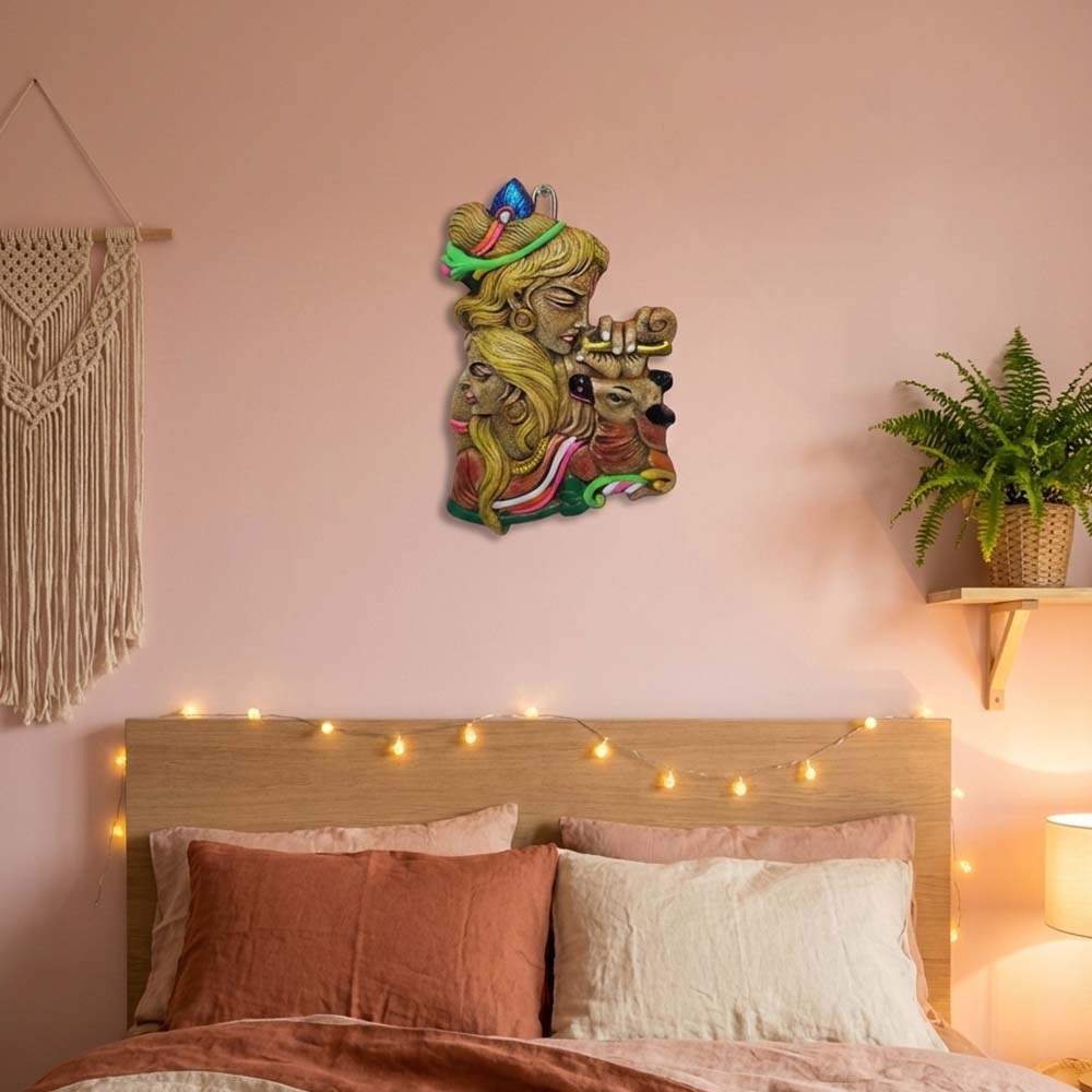 Terracotta wall hanging depicting the Hindu deities Radha and Krishna with a deer.