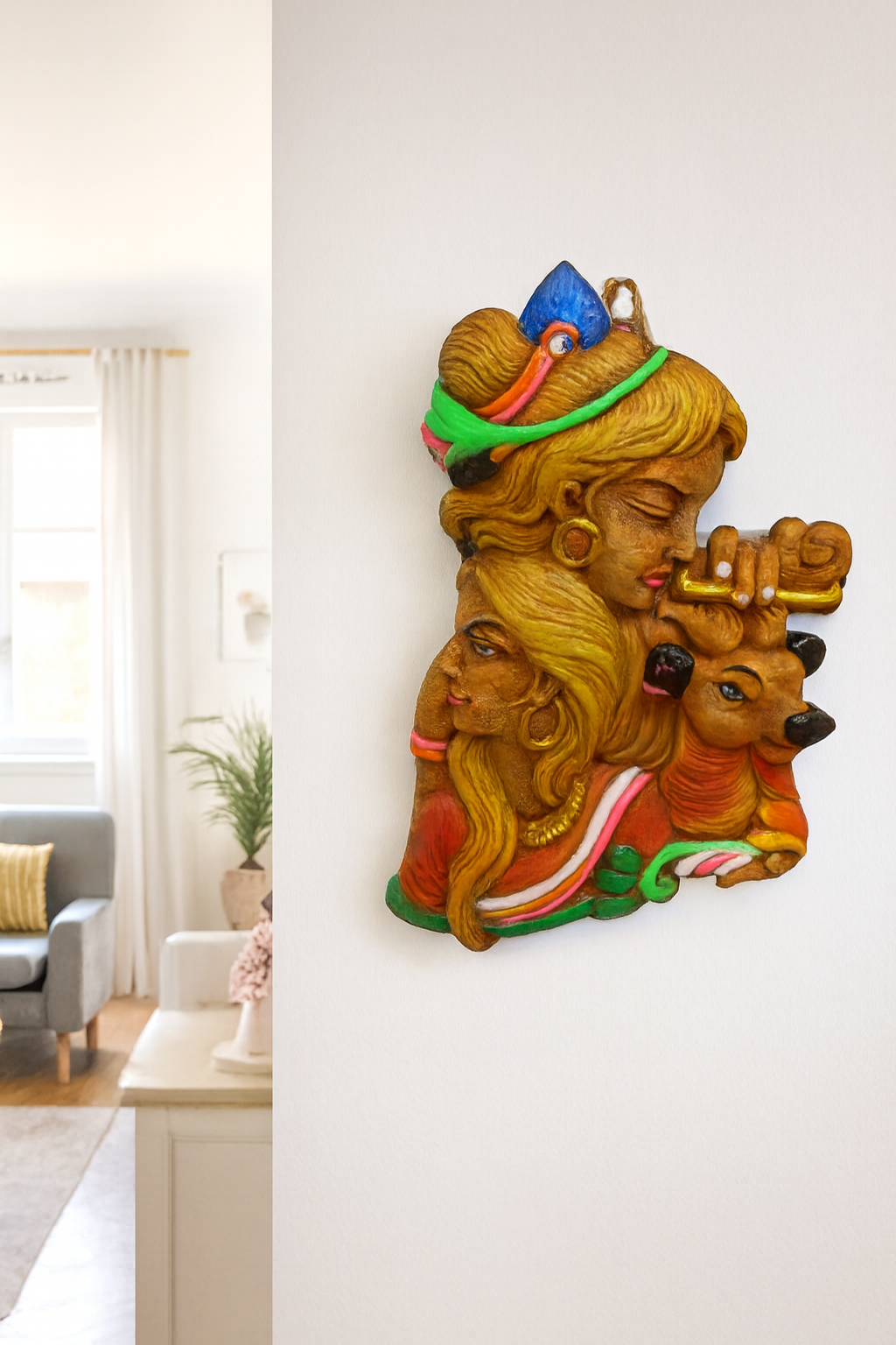 Terracotta wall hanging depicting the Hindu deities Radha and Krishna with a deer.